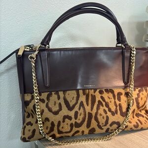 Coach Borough bag featuring leopard print hair calf with leather upper.